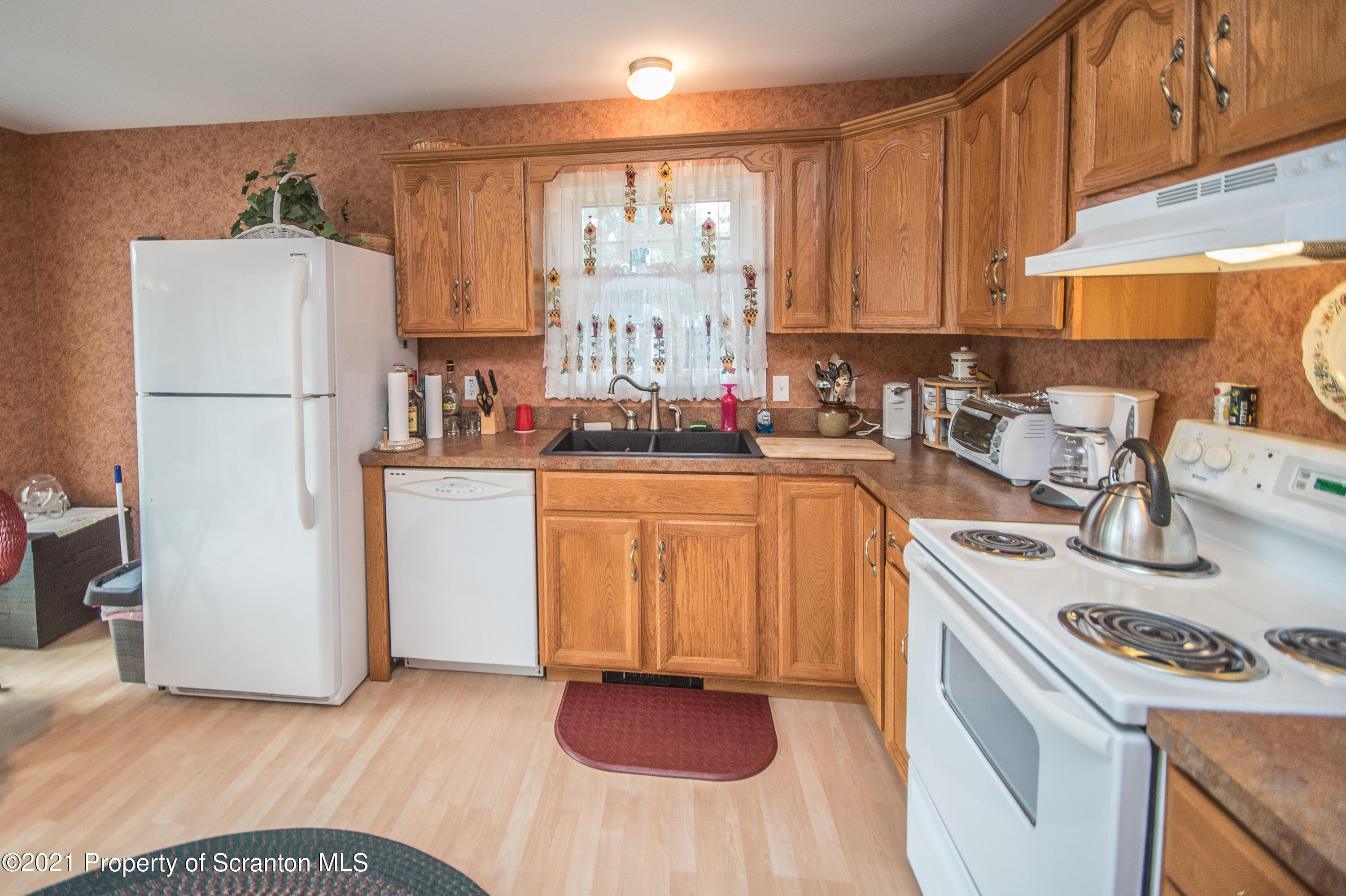 34 Taylor Farm Road Union Dale, PA 18470 - Photo 18 of 38 a kitchen with a sink stove and refrigerator
