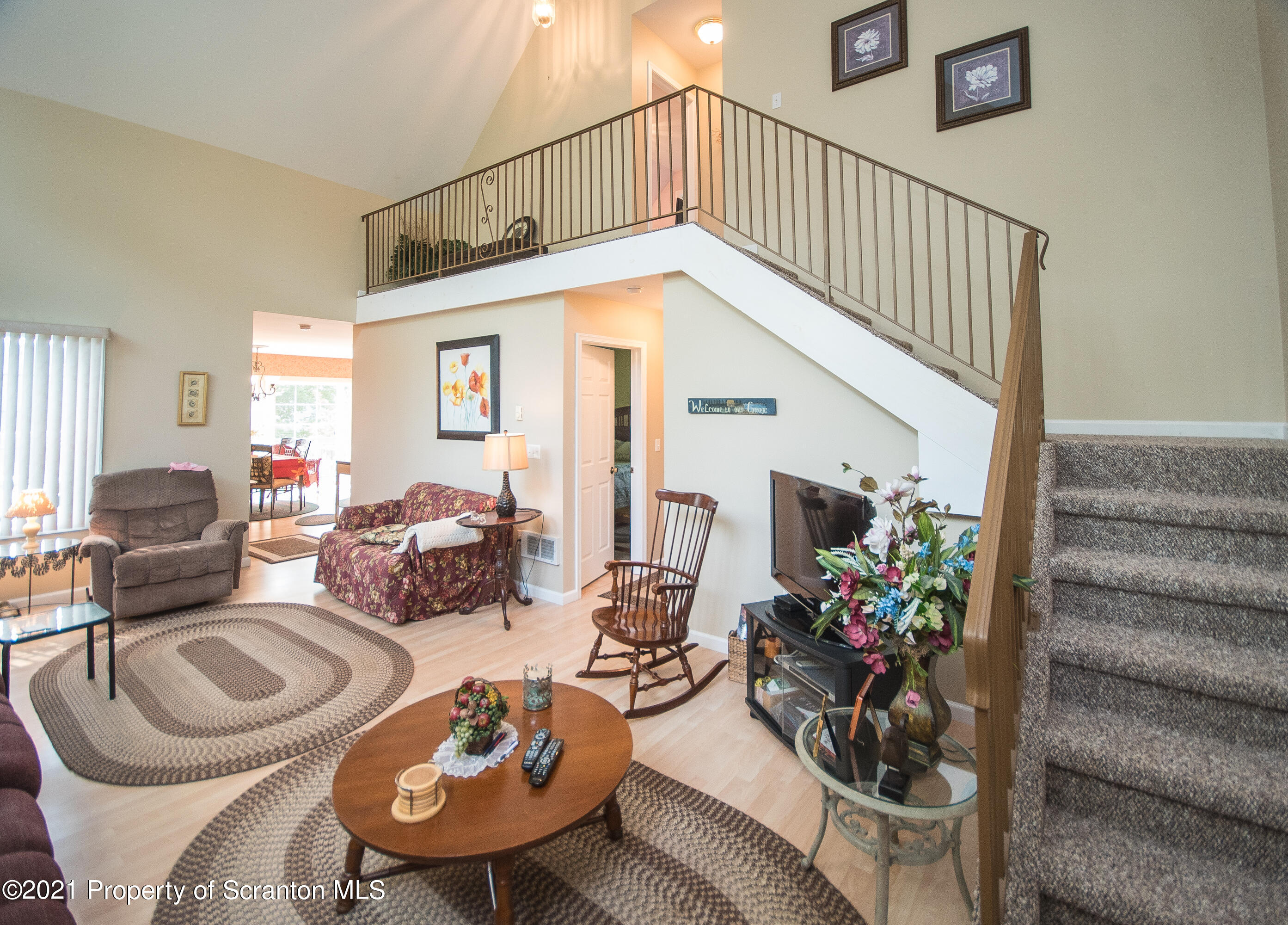 34 Taylor Farm Road Union Dale, PA 18470 - Photo 22 of 38 a living room with furniture flowerpot and a chandelier