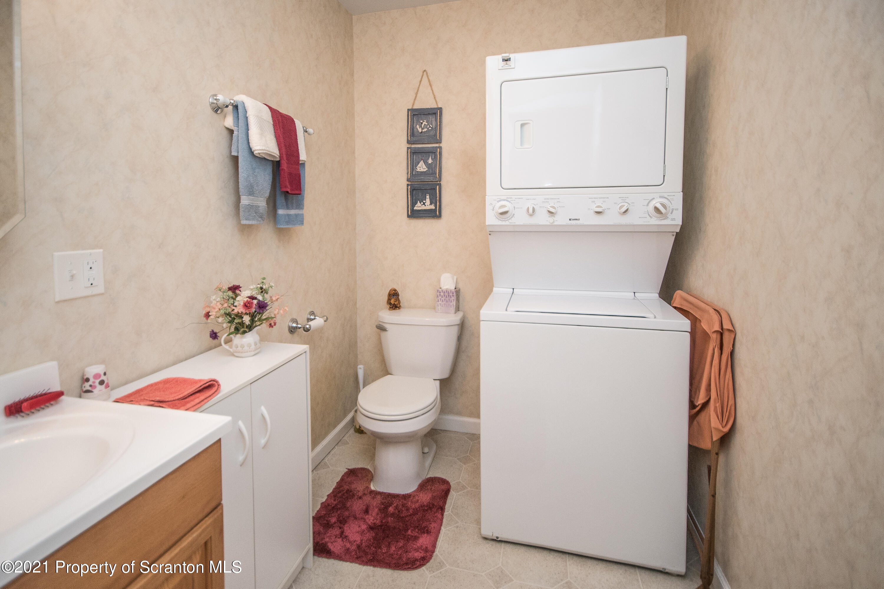 34 Taylor Farm Road Union Dale, PA 18470 - Photo 28 of 38 a white toilet sitting next to a bathroom sink