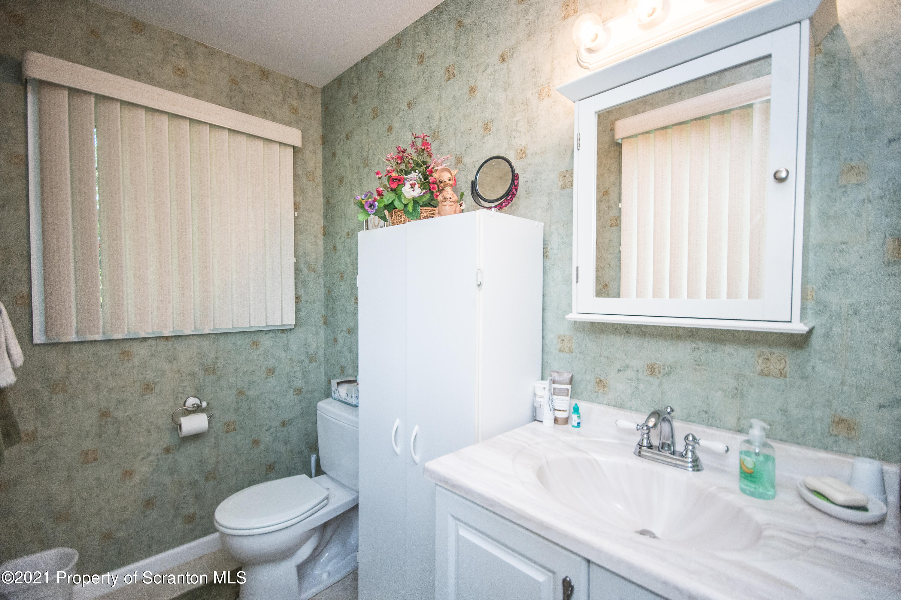 34 Taylor Farm Road Union Dale, PA 18470 - Photo 31 of 38 a bathroom with a sink a toilet and a mirror