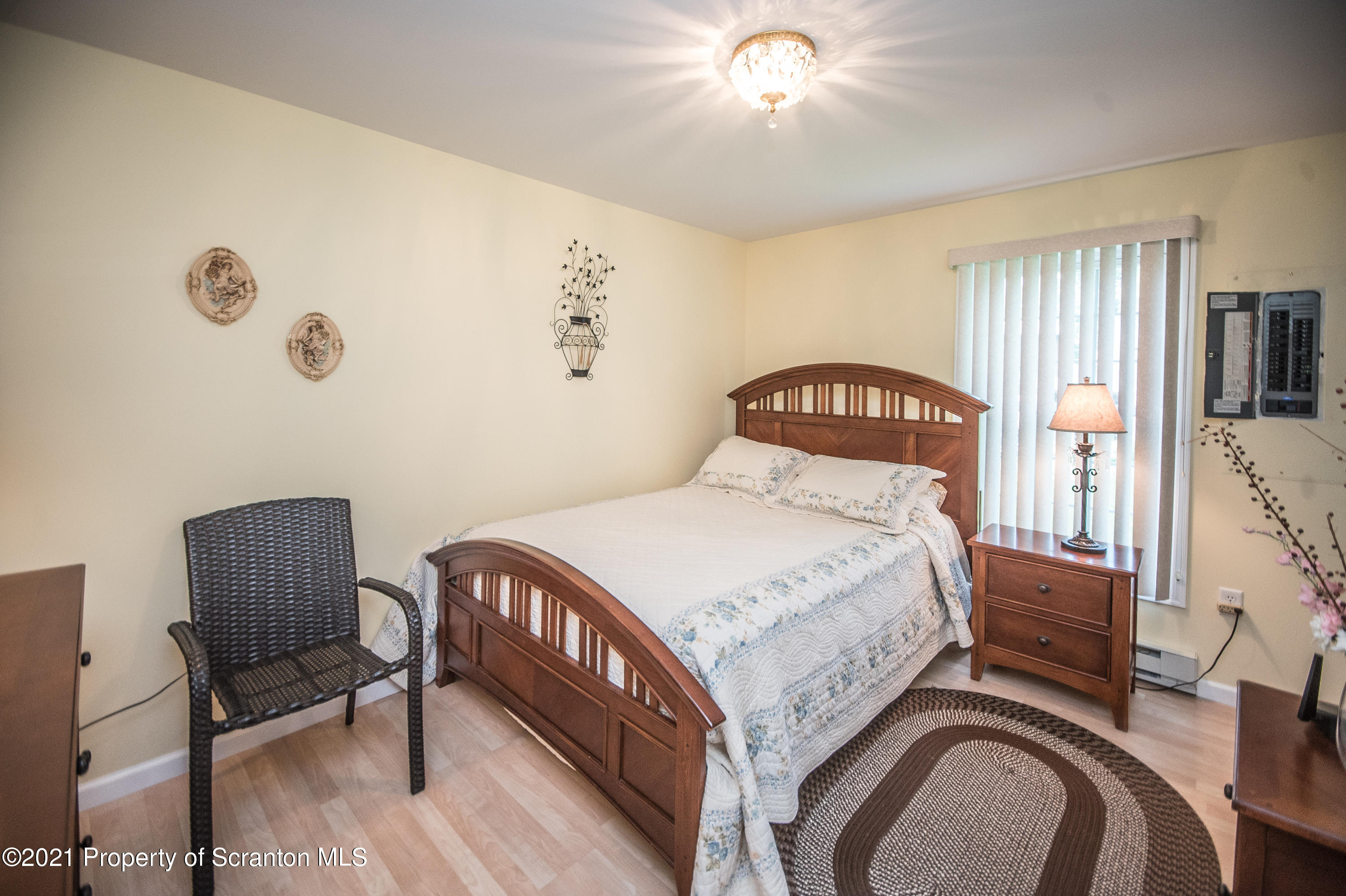 34 Taylor Farm Road Union Dale, PA 18470 - Photo 33 of 38 a bedroom with a bed and a chair