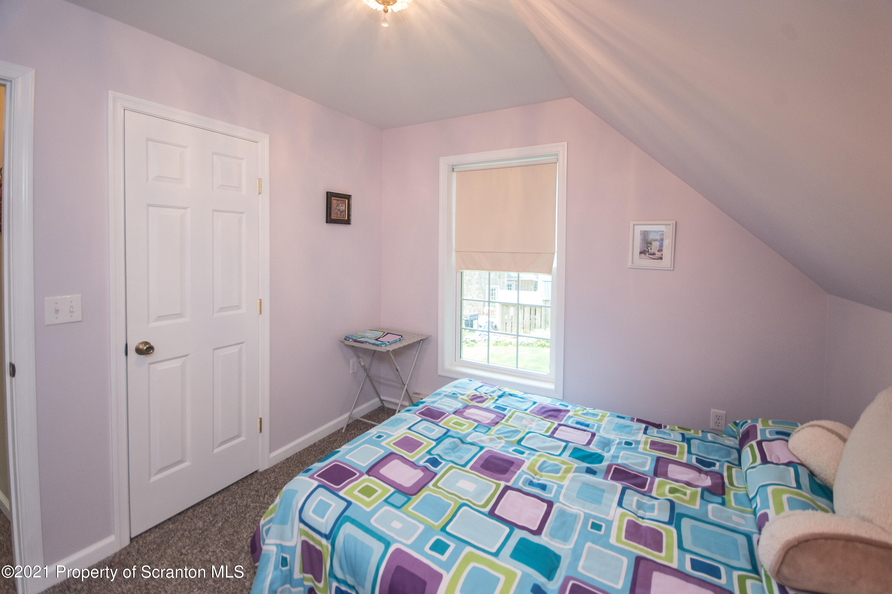 34 Taylor Farm Road Union Dale, PA 18470 - Photo 36 of 38 a bedroom with a bed and a window