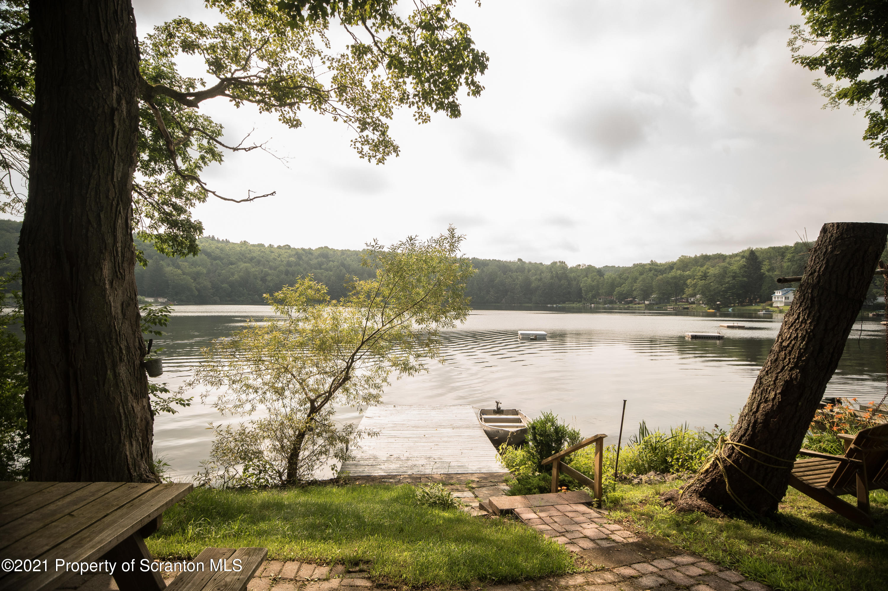 34 Taylor Farm Road Union Dale, PA 18470 - Photo 5 of 38 a view of a lake with table and chairs