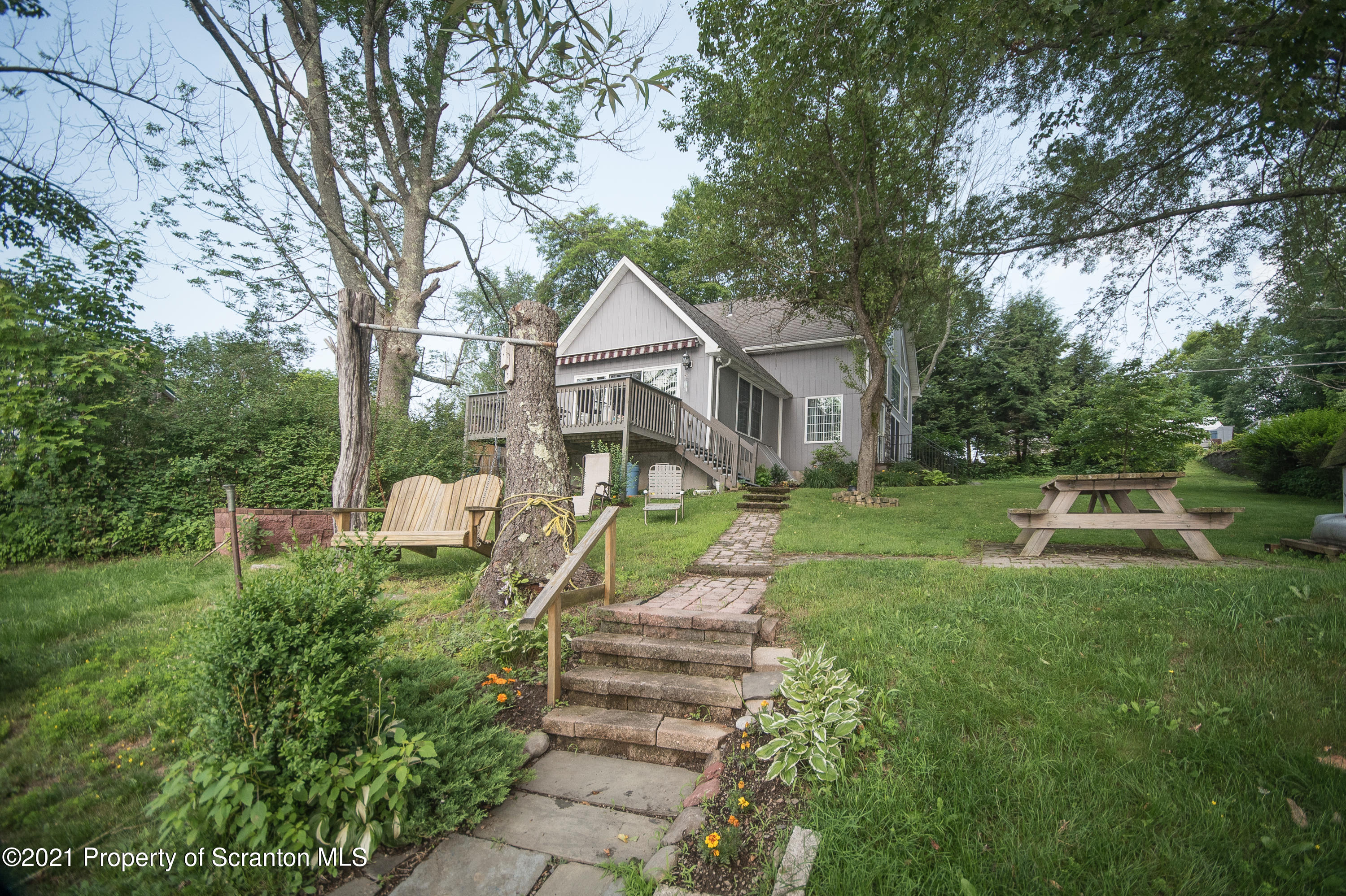 34 Taylor Farm Road Union Dale, PA 18470 - Photo 7 of 38 a front view of a house with yard and green space