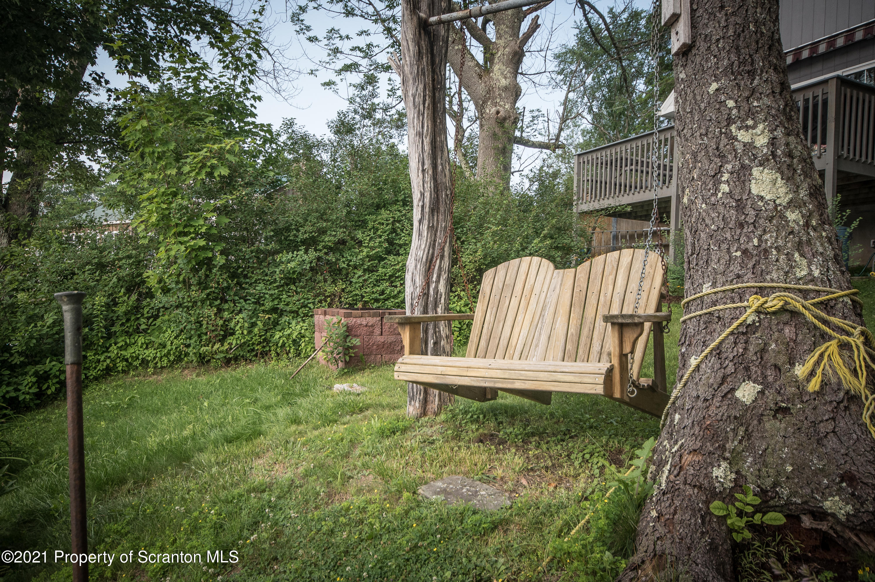 34 Taylor Farm Road Union Dale, PA 18470 - Photo 8 of 38 a view of a bench in the garden
