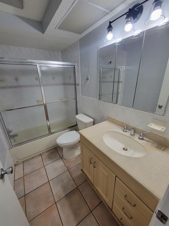 11633 Fox Run Port Richey, FL 34668 - Photo 21 of 33 a spacious bathroom with a sink a toilet a mirror and shower