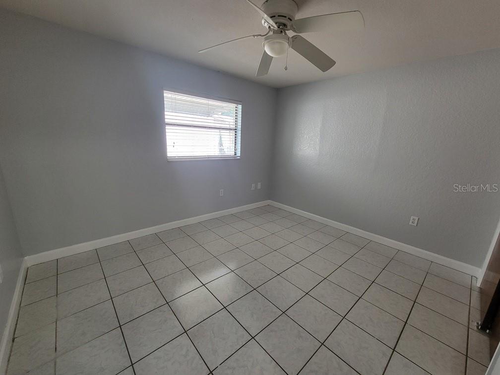 11633 Fox Run Port Richey, FL 34668 - Photo 22 of 33 an empty room with windows