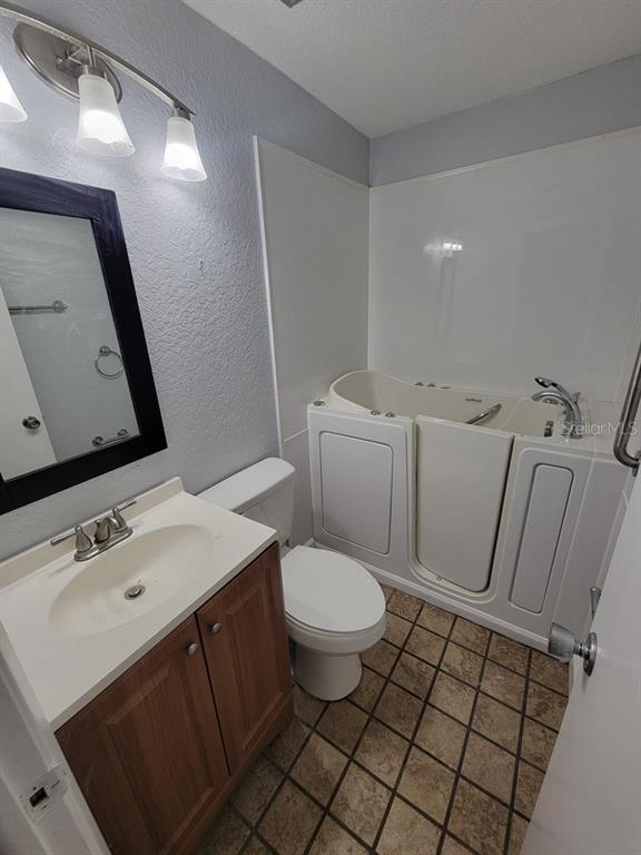 11633 Fox Run Port Richey, FL 34668 - Photo 23 of 33 a bathroom with a sink toilet and mirror