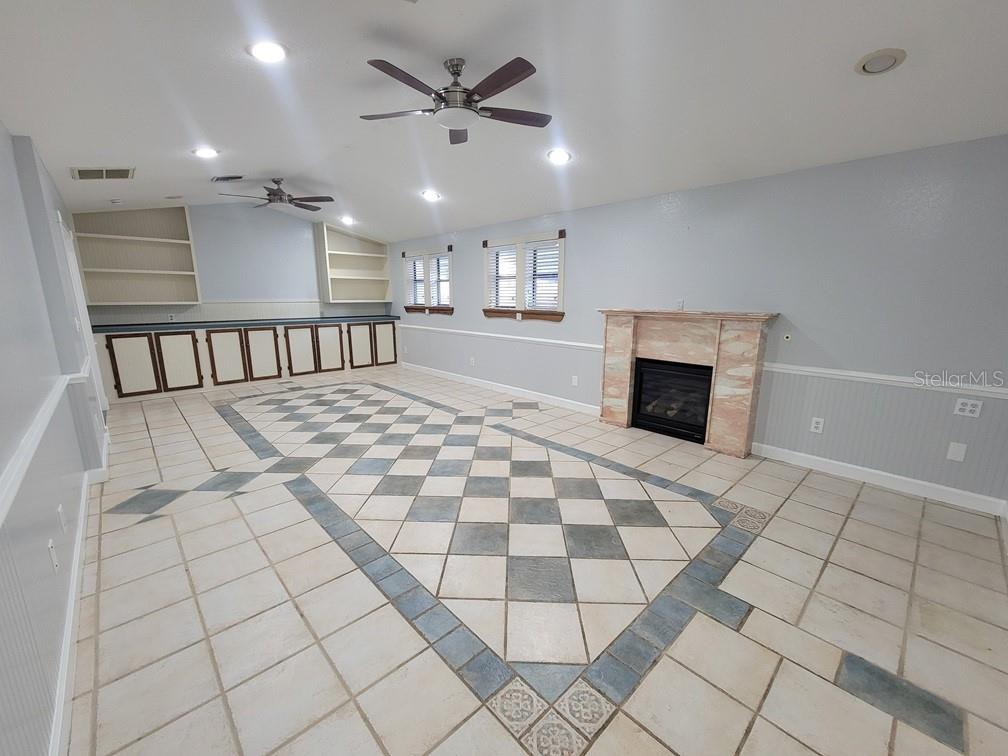11633 Fox Run Port Richey, FL 34668 - Photo 27 of 33 a view of a hallway with a fireplace and window