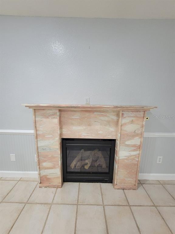 11633 Fox Run Port Richey, FL 34668 - Photo 28 of 33 a room with a fireplace