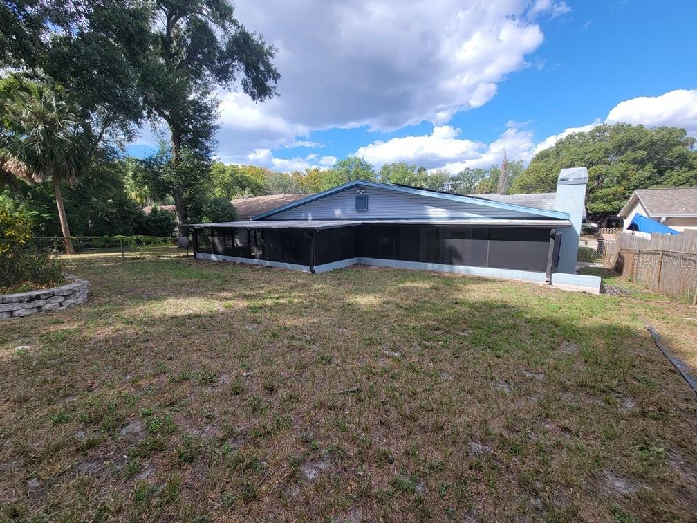 11633 Fox Run Port Richey, FL 34668 - Photo 32 of 33 a view of a house with a yard
