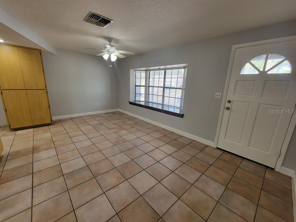 11633 Fox Run Port Richey, FL 34668 - Photo 4 of 33 an empty room with windows