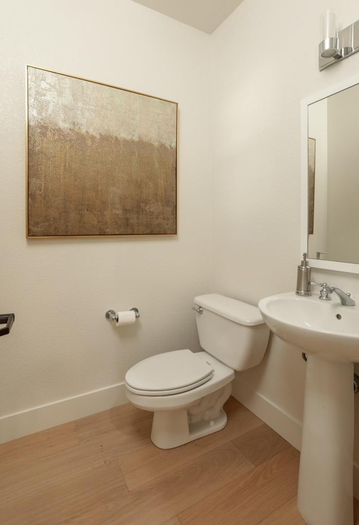 595 Willow Road Menlo Park, CA 94025 - Photo 14 of 28 a bathroom with a toilet sink and mirror