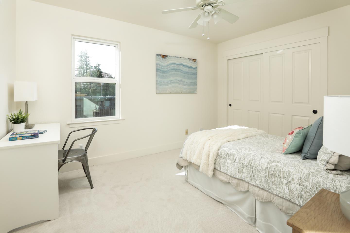 595 Willow Road Menlo Park, CA 94025 - Photo 15 of 28 a bedroom with a bed a table and chair