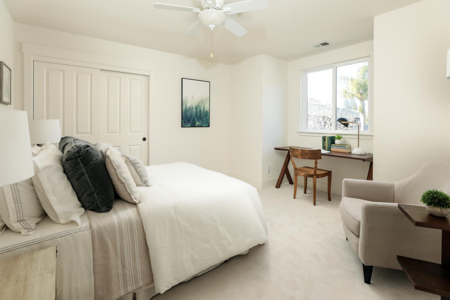 595 Willow Road Menlo Park, CA 94025 - Photo 16 of 28 a bedroom with a bed a table and a painting