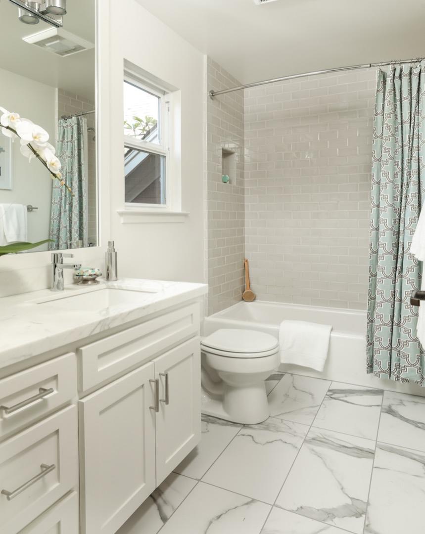 595 Willow Road Menlo Park, CA 94025 - Photo 17 of 28 a bathroom with a toilet a sink and a mirror