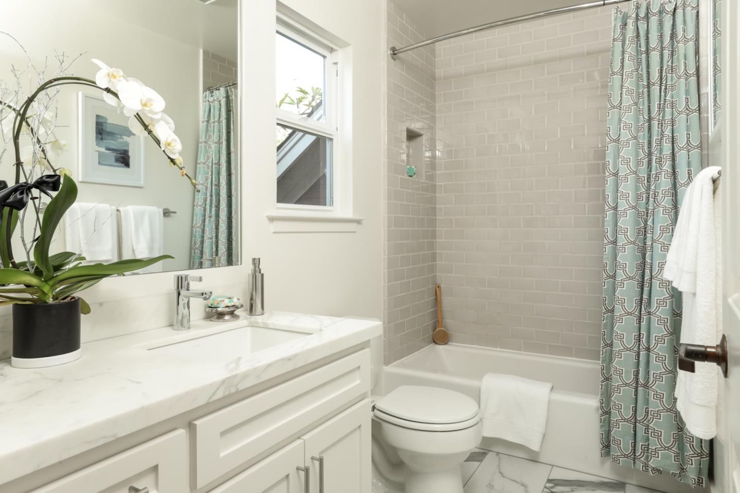 595 Willow Road Menlo Park, CA 94025 - Photo 18 of 28 a bathroom with a sink a toilet and shower