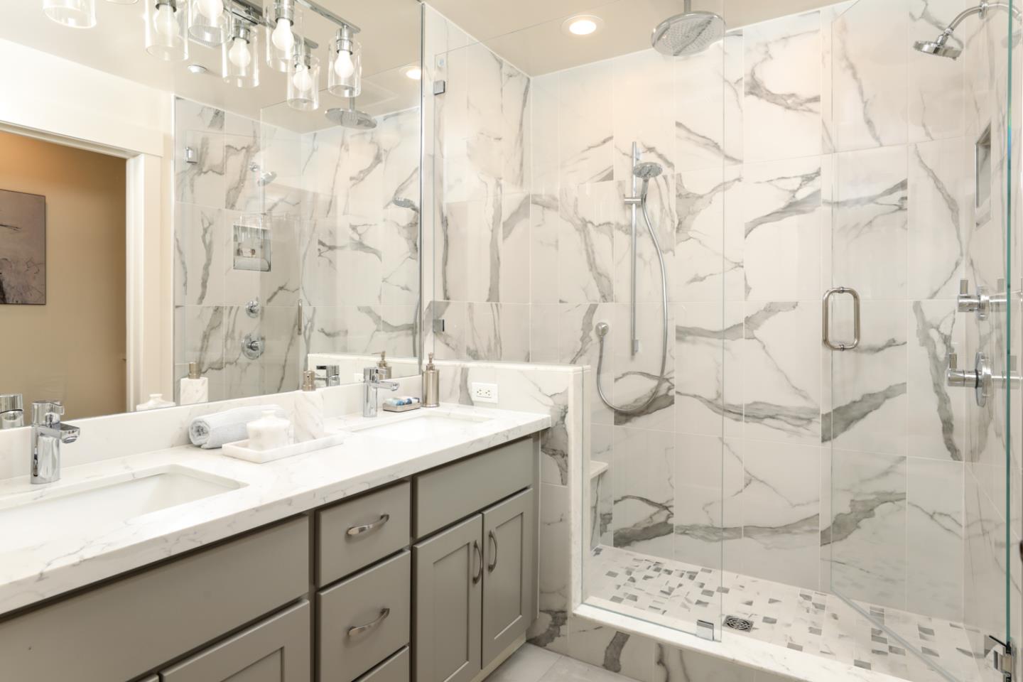 595 Willow Road Menlo Park, CA 94025 - Photo 22 of 28 a bathroom with a sink double vanity and a shower