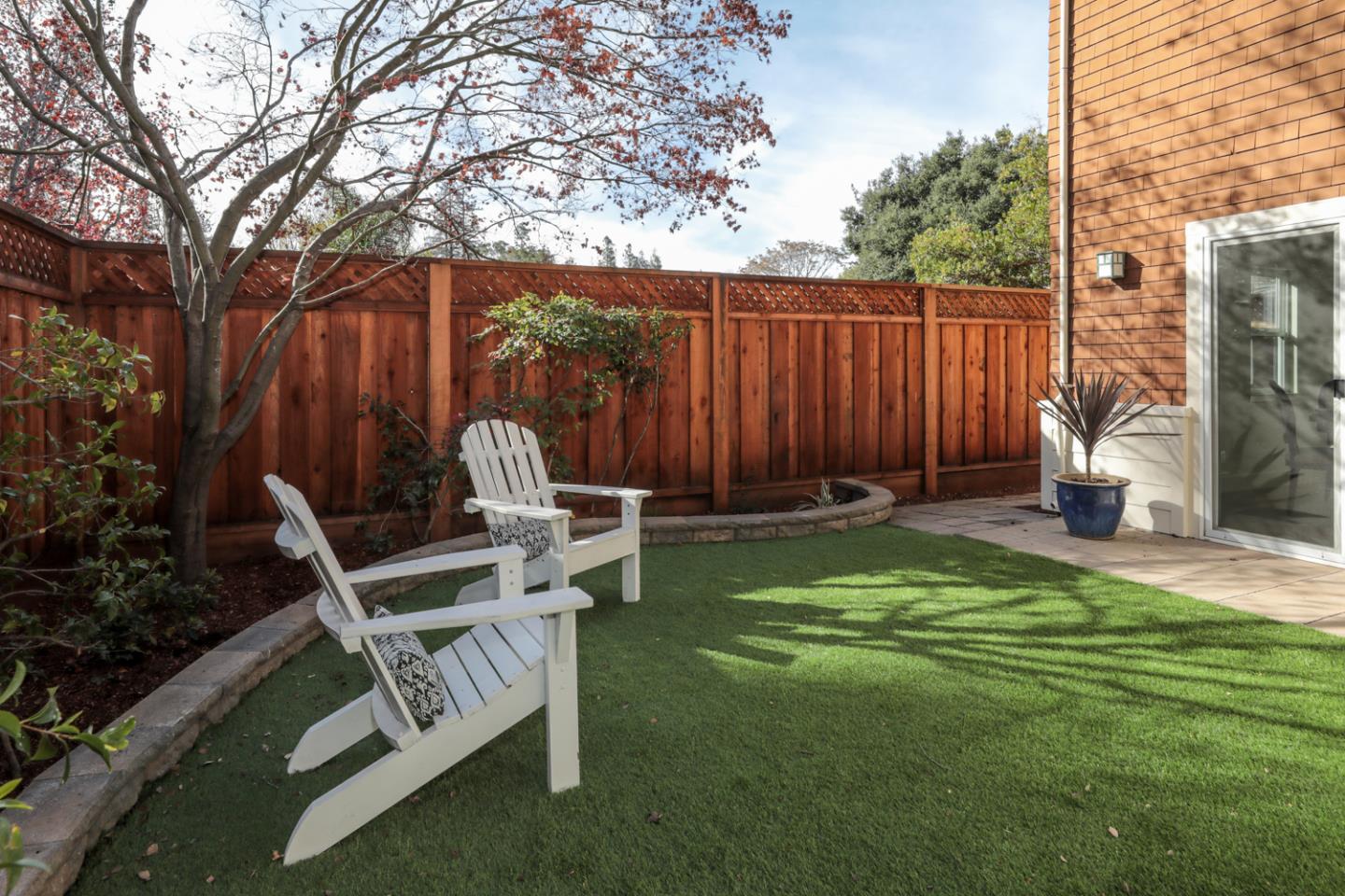 595 Willow Road Menlo Park, CA 94025 - Photo 27 of 28 a view of a chairs and table in the backyard