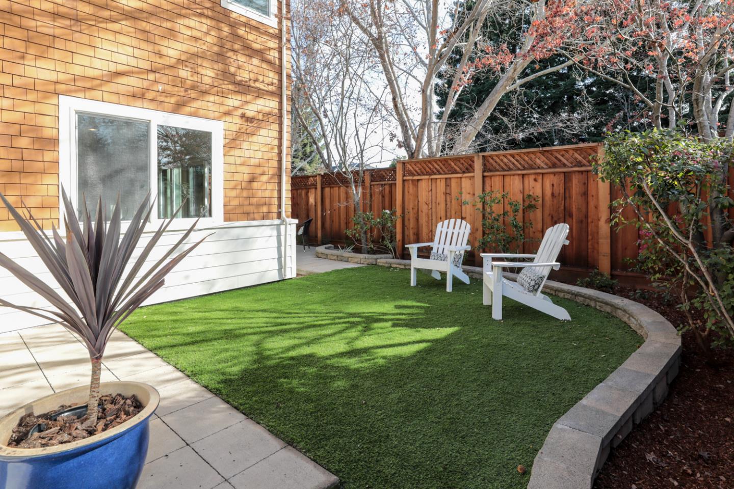 595 Willow Road Menlo Park, CA 94025 - Photo 28 of 28 a view of a chair and table in backyard of the house