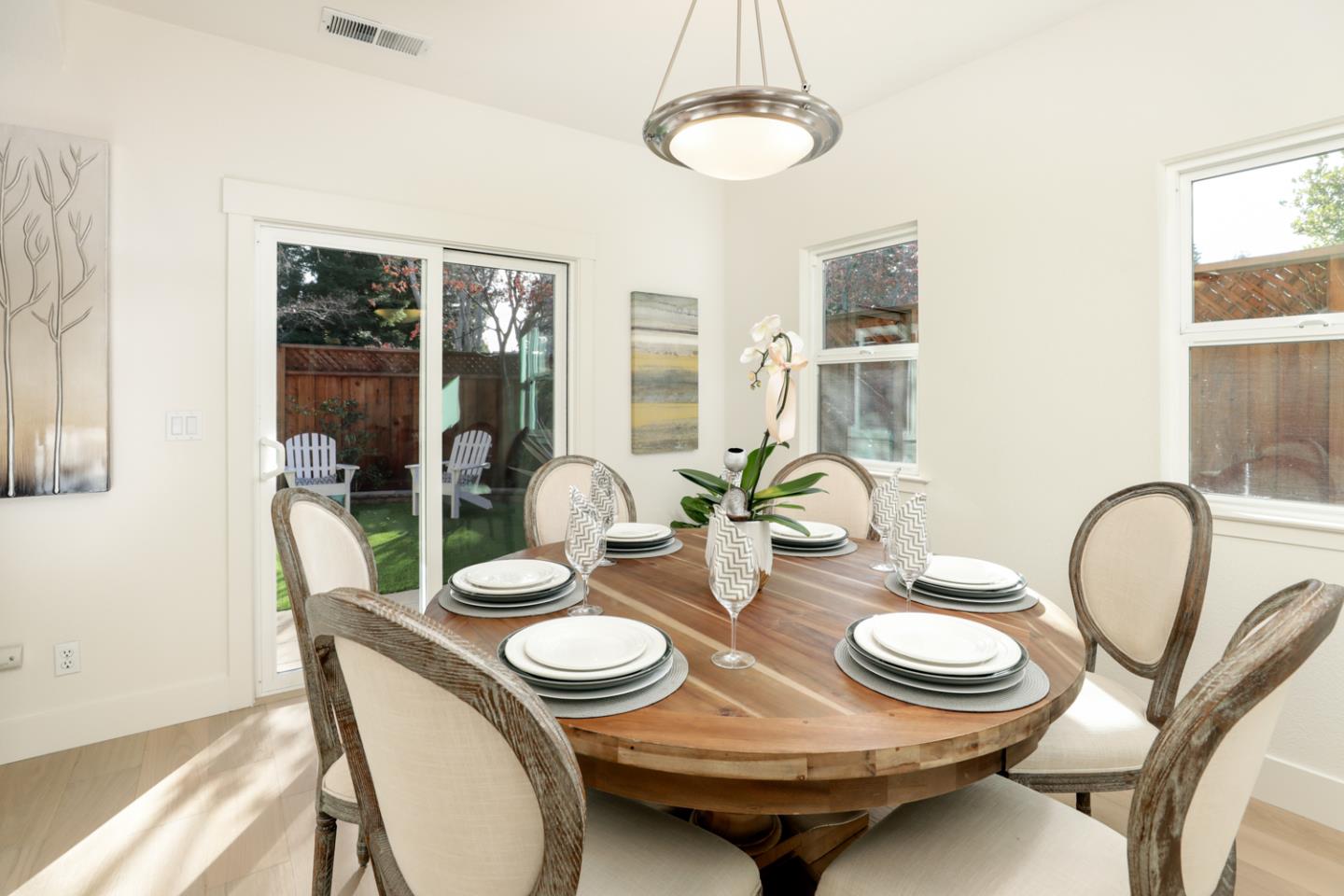595 Willow Road Menlo Park, CA 94025 - Photo 6 of 28 a table and chairs in a dining room with a table