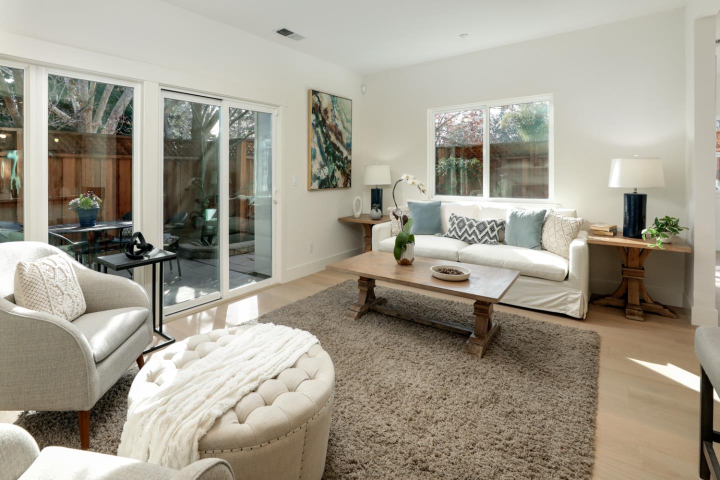 595 Willow Road Menlo Park, CA 94025 - Photo 9 of 28 a living room with furniture and a large window