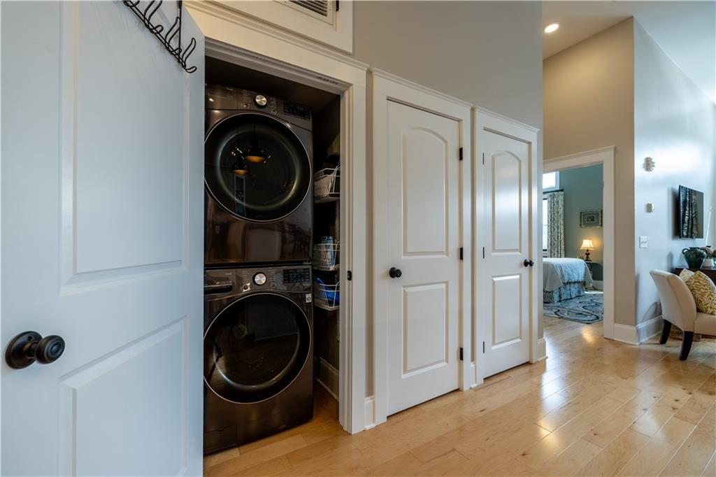 1 East 3rd Avenue, Unit 302 Rome, GA 30161 - Photo 12 of 36 a view of a hallway with washer and dryer