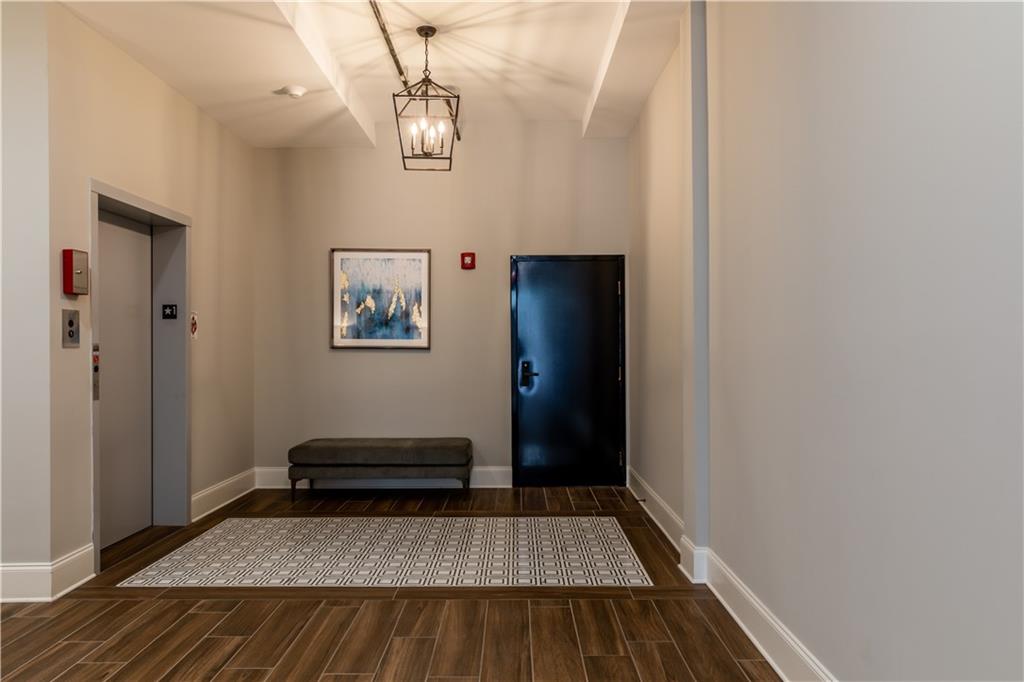 1 East 3rd Avenue, Unit 302 Rome, GA 30161 - Photo 14 of 36 a view of livingroom with furniture and wooden floor