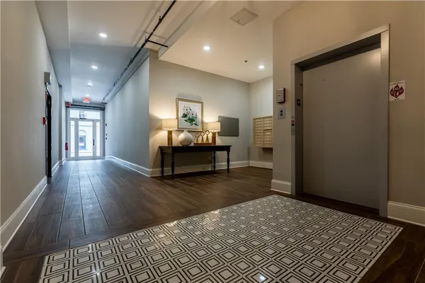 a view of a livingroom with furniture and a workspace