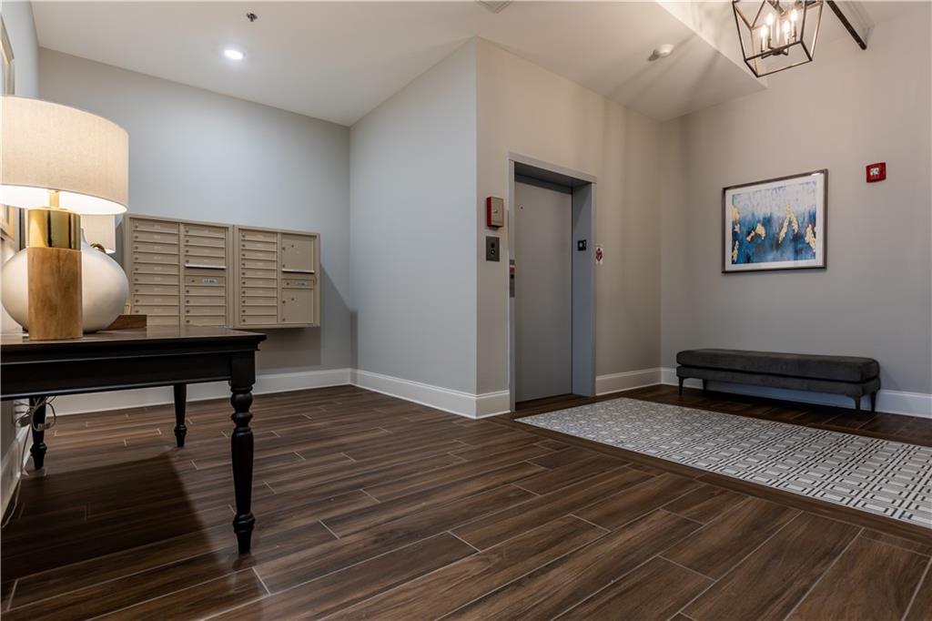 1 East 3rd Avenue, Unit 302 Rome, GA 30161 - Photo 18 of 36 a view of a livingroom with furniture and a workspace