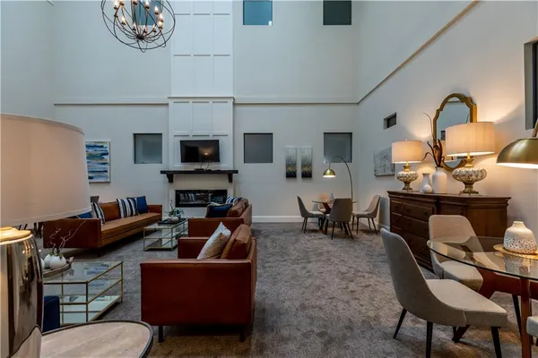 a living room with fireplace furniture and a flat screen tv