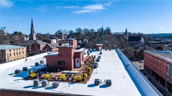 a view of roof deck with seating space