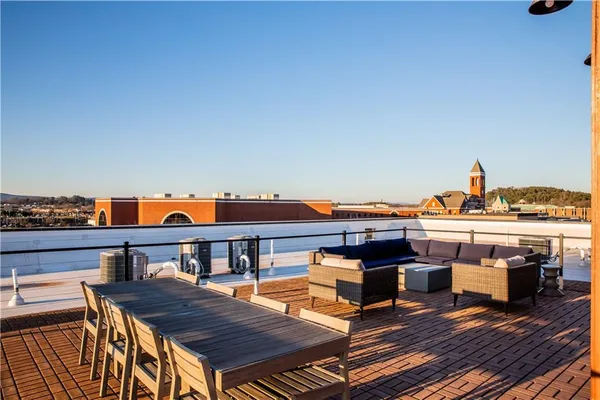 a front view of a house with balcony and patio