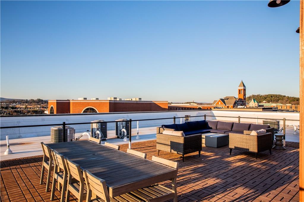 1 East 3rd Avenue, Unit 302 Rome, GA 30161 - Photo 28 of 36 a view of roof deck with seating space