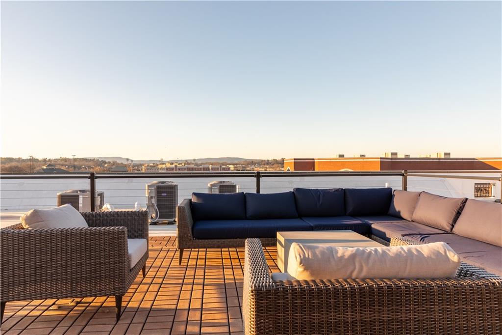 1 East 3rd Avenue, Unit 302 Rome, GA 30161 - Photo 30 of 36 a balcony with a couch
