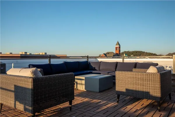 a terrace of a house with outdoor seating