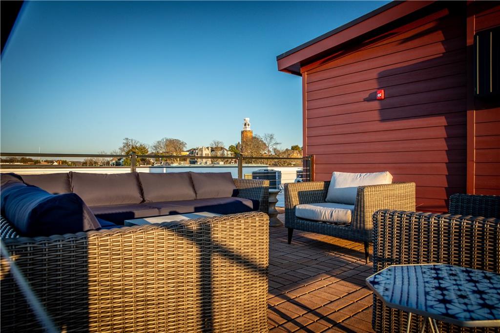 1 East 3rd Avenue, Unit 302 Rome, GA 30161 - Photo 32 of 36 a terrace of a house with outdoor seating