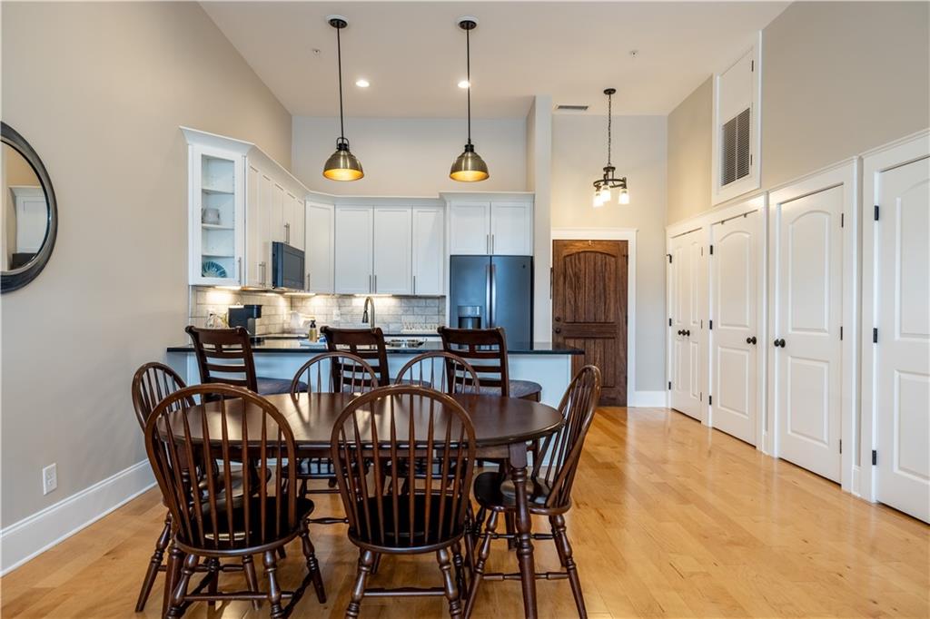 1 East 3rd Avenue, Unit 302 Rome, GA 30161 - Photo 7 of 36 a view of a dining room with furniture