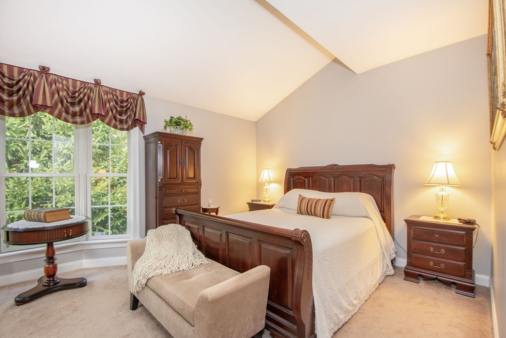 53 Hemlock Circle, Unit 53 Hanover, MA 02339 - Photo 11 of 27 a bedroom with bed and wooden floor