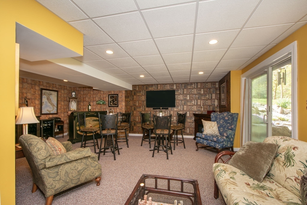 53 Hemlock Circle, Unit 53 Hanover, MA 02339 - Photo 17 of 27 a living room with furniture and a large window