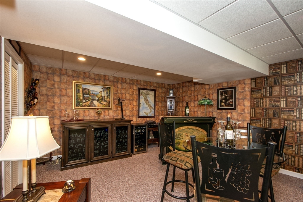 53 Hemlock Circle, Unit 53 Hanover, MA 02339 - Photo 18 of 27 a dining area with furniture and chandelier