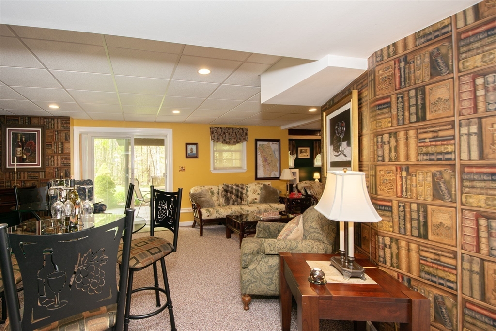 53 Hemlock Circle, Unit 53 Hanover, MA 02339 - Photo 19 of 27 a living room with furniture and a lamp
