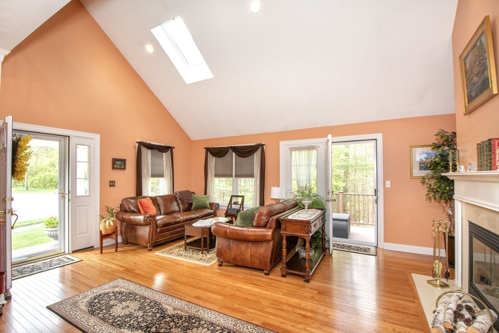 53 Hemlock Circle, Unit 53 Hanover, MA 02339 - Photo 5 of 27 a living room with furniture and a table