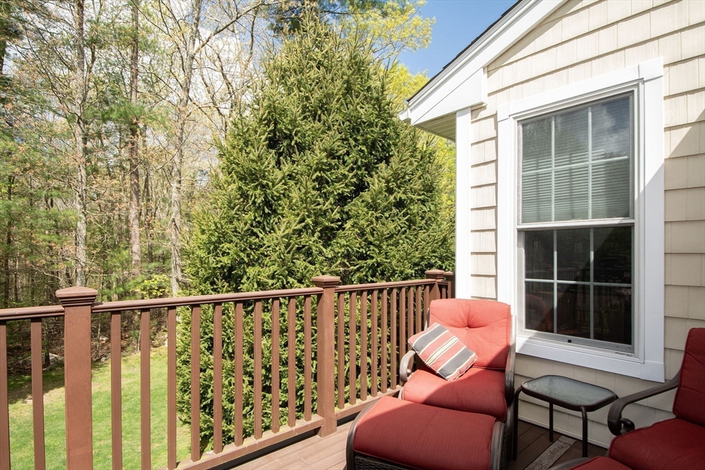 53 Hemlock Circle, Unit 53 Hanover, MA 02339 - Photo 7 of 27 a view of a chair and table in the balcony