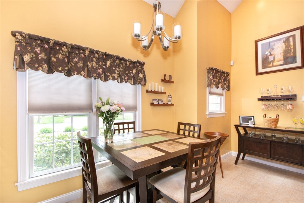 53 Hemlock Circle, Unit 53 Hanover, MA 02339 - Photo 10 of 27 a view of a dining room with furniture window and wooden floor