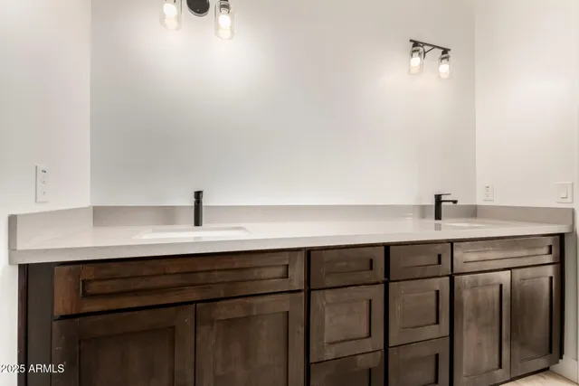 a sink with a white cabinet