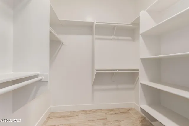 a view of an empty walk in closet