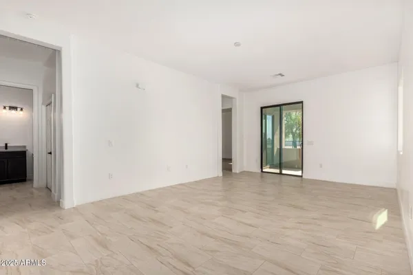 a view of an empty room with a window