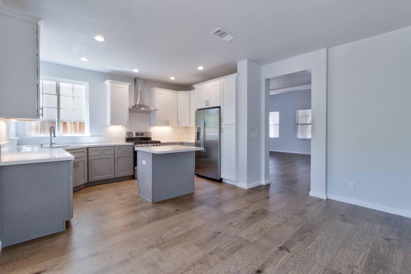 2715 Shellgate Circle Hayward, CA 94545 - Photo 9 of 47 a kitchen with a sink cabinets and wooden floor