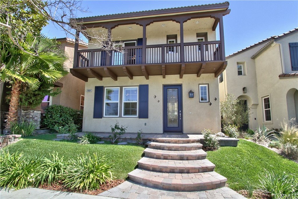 28964 Newport Road Temecula, CA 92591 - Photo 1 of 1 a front view of a house with a garden